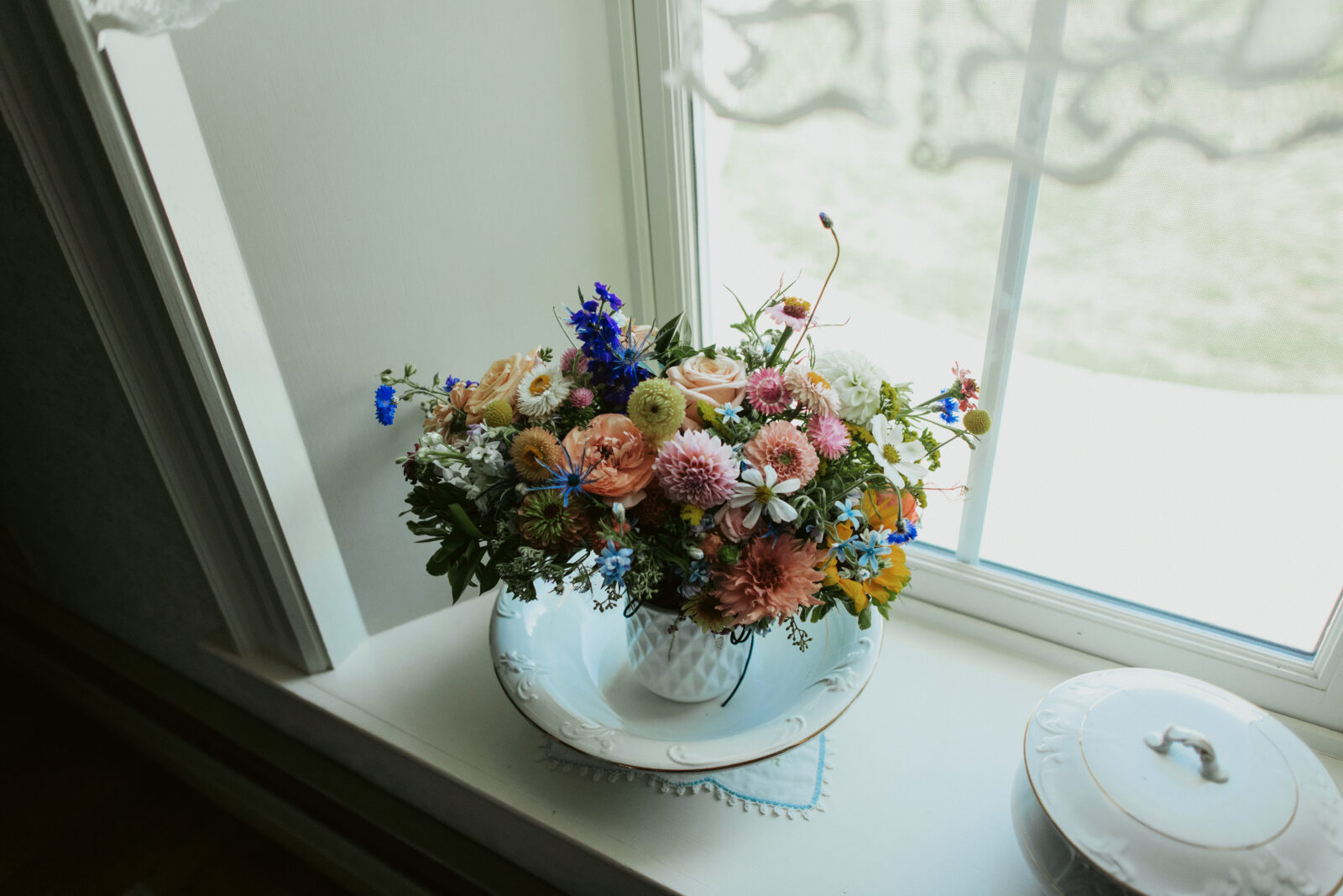 wildflower wedding bouquet sitting by window